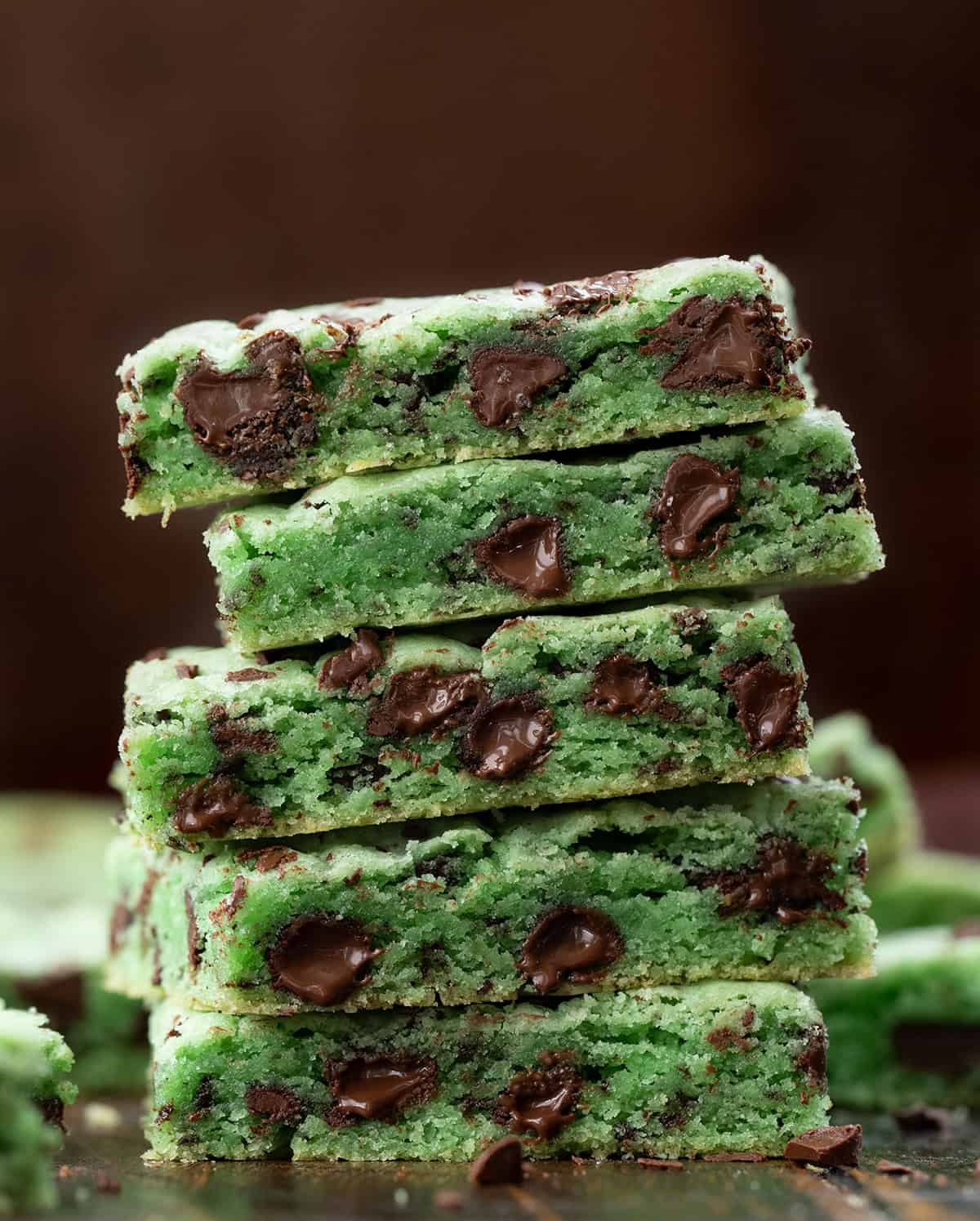 Stack of Sheet Pan Mint Chocolate Chip Cookies very close up so the texture and melty chips are very close.