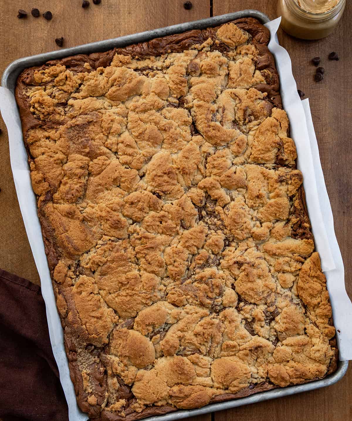 Sheet pan of Peanut Butter Brookies on a wooden table from overhead Sheet pan of Peanut Butter Brookies on a wooden table from overhead.
