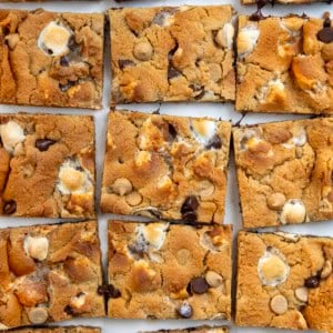Sheet Pan Peanut Butter Marshmallow Cookies cut into squares on a white table.