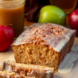 Loaf of Apple Cider Fritter Bread that has been cut into and a few slices are laying in front of.