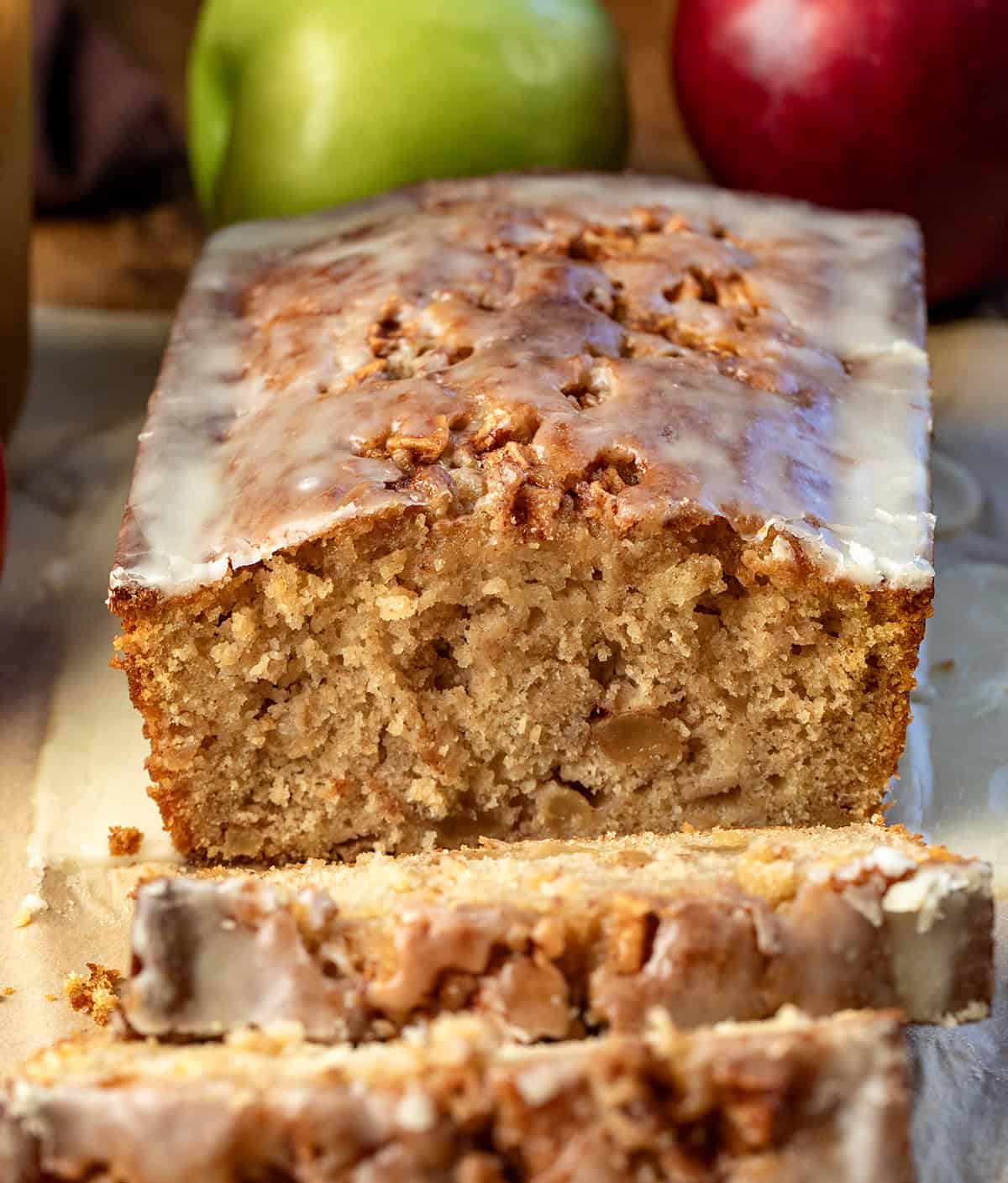 Loaf of Apple Cider Fritter Bread that has been cut into and a few slices are laying in front of.