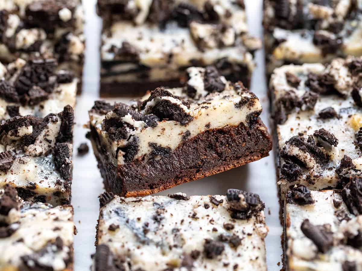 Close up of a Cookies and Cream Brownie at an angle surrounded by more brownies.