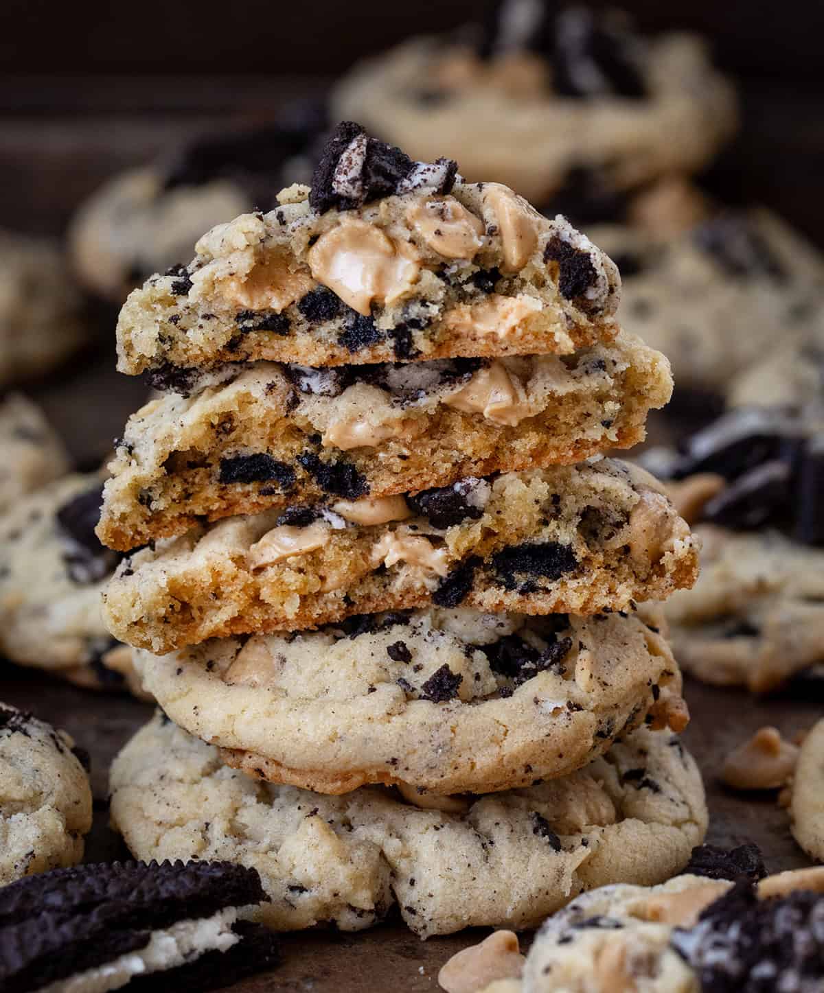 Stack of Peanut Butter Oreo Cookies that have been halved showing the inside texture.