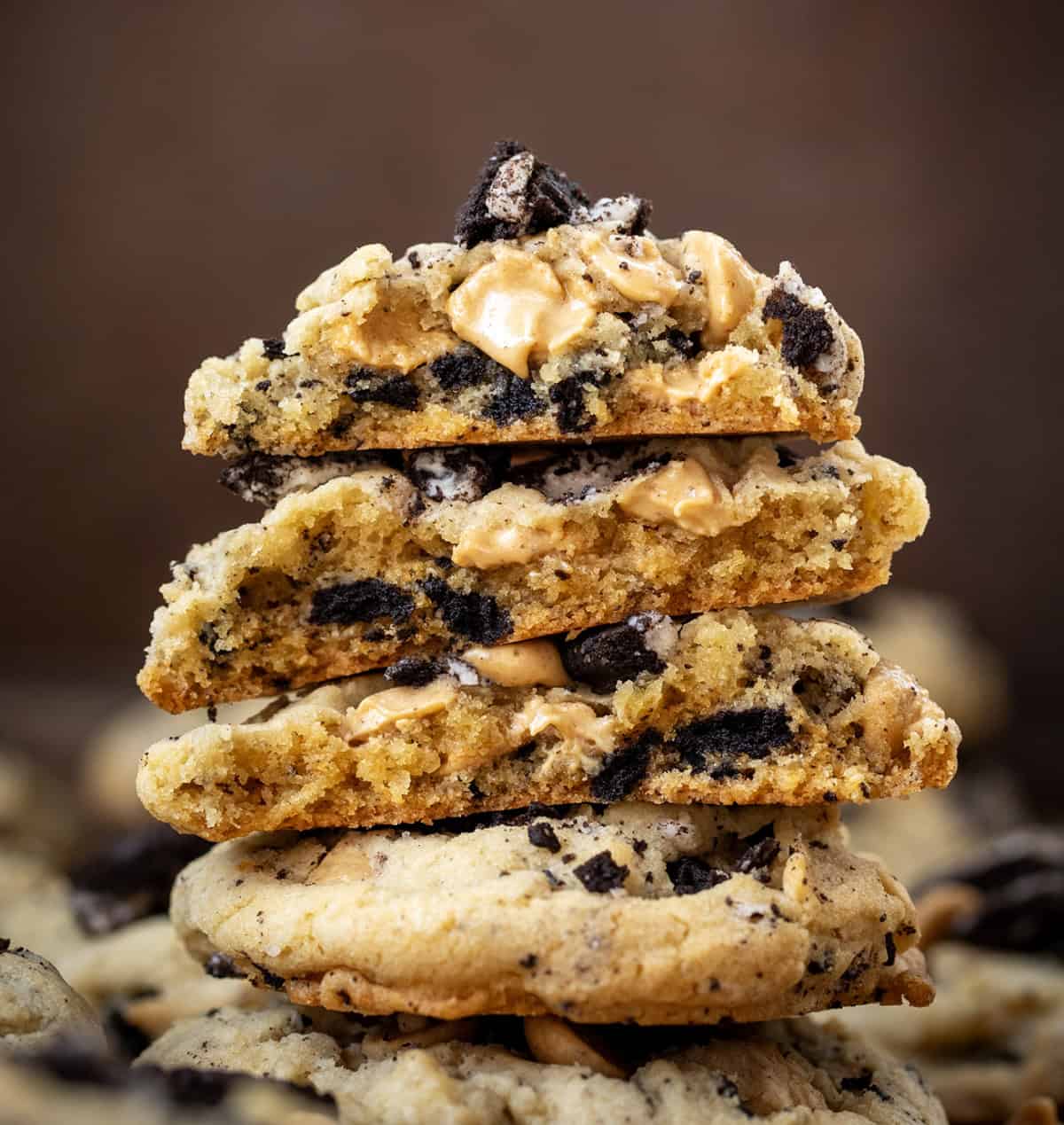 Looking straight on at a stack of Peanut Butter Oreo Cookies that have been halved showing the inside texture.