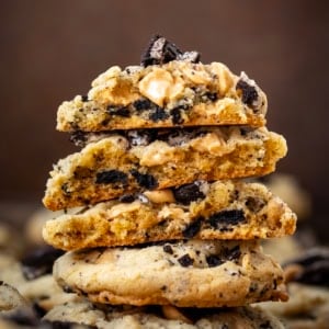Looking straight on at a stack of Peanut Butter Oreo Cookies that have been halved showing the inside texture.
