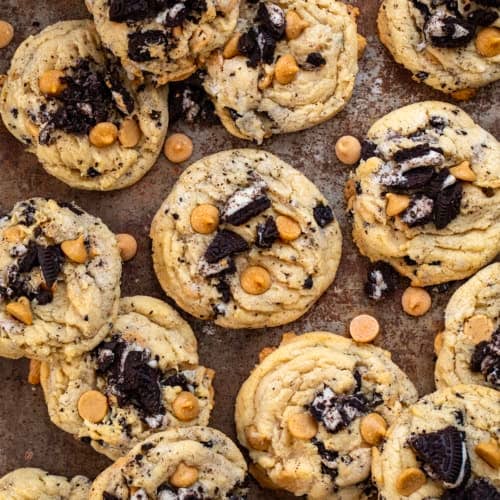 Peanut Butter Oreo Cookies on a table from overhead with oreo pieces and peanut butter morsels.