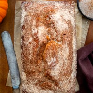 Pumpkin Donut Bread on a wooden table from overhead.