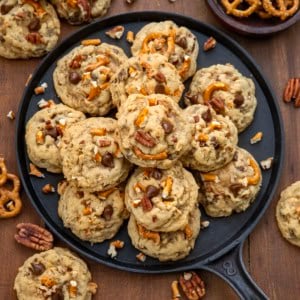 Brown Sugar Cowboy Cookies on a skillet on a wooden table from overhead.