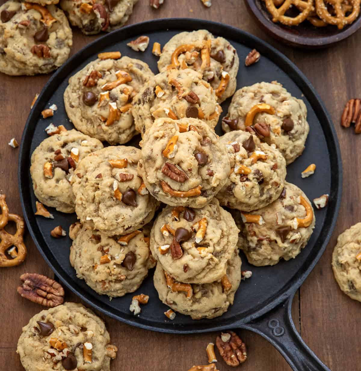 Brown Sugar Cowboy Cookies on a skillet on a wooden table from overhead.