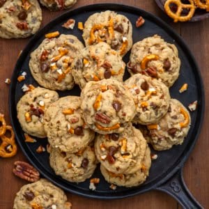 Brown Sugar Cowboy Cookies on a skillet on a wooden table from overhead.