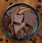 Plate of Coffee Toffee on a wooden table from overhead.