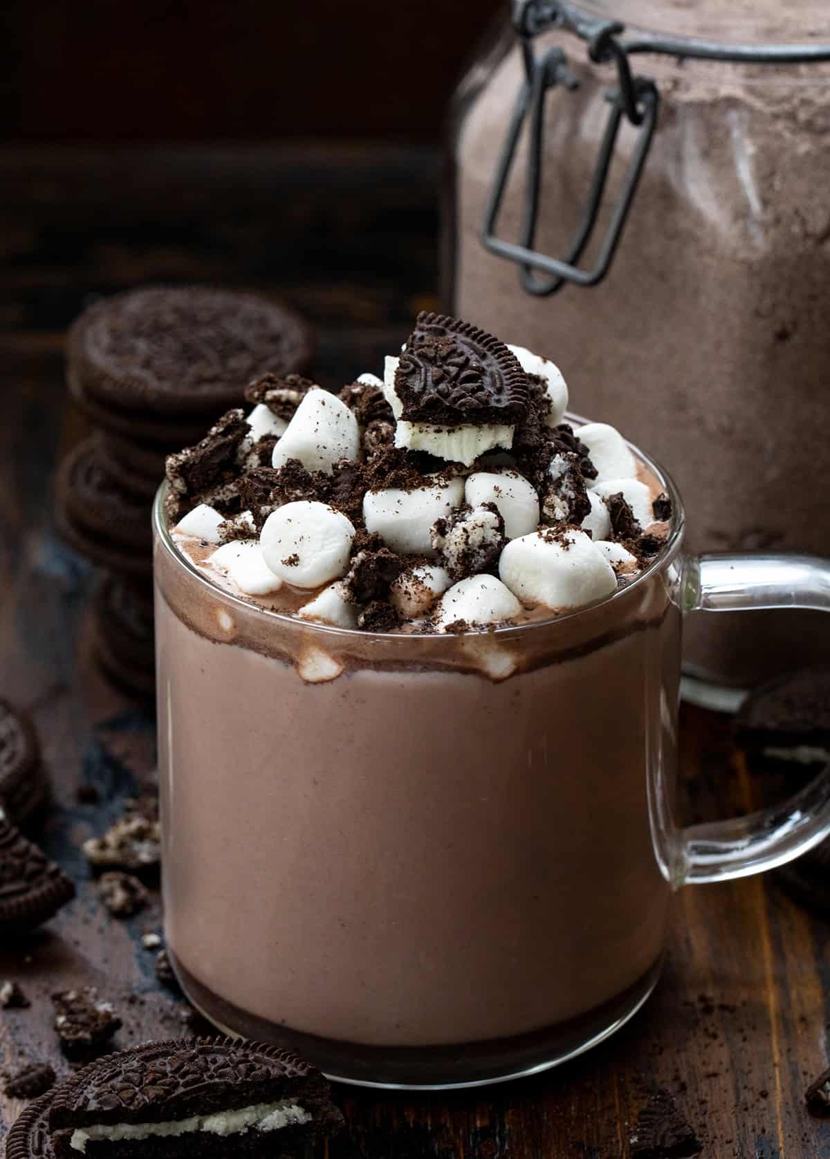 Hot cup of Cookies & Cream Hot Cocoa Mix in front of the jar.