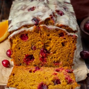 Slice of Cranberry Orange Pumpkin Bread with a few slices cut.