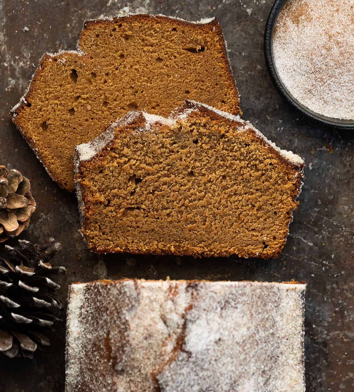 Loaf of Gingerbread Donut Bread with a couple of pieces cut and laying flat from overhead Loaf of Gingerbread Donut Bread with a couple of pieces cut and laying flat from overhead.