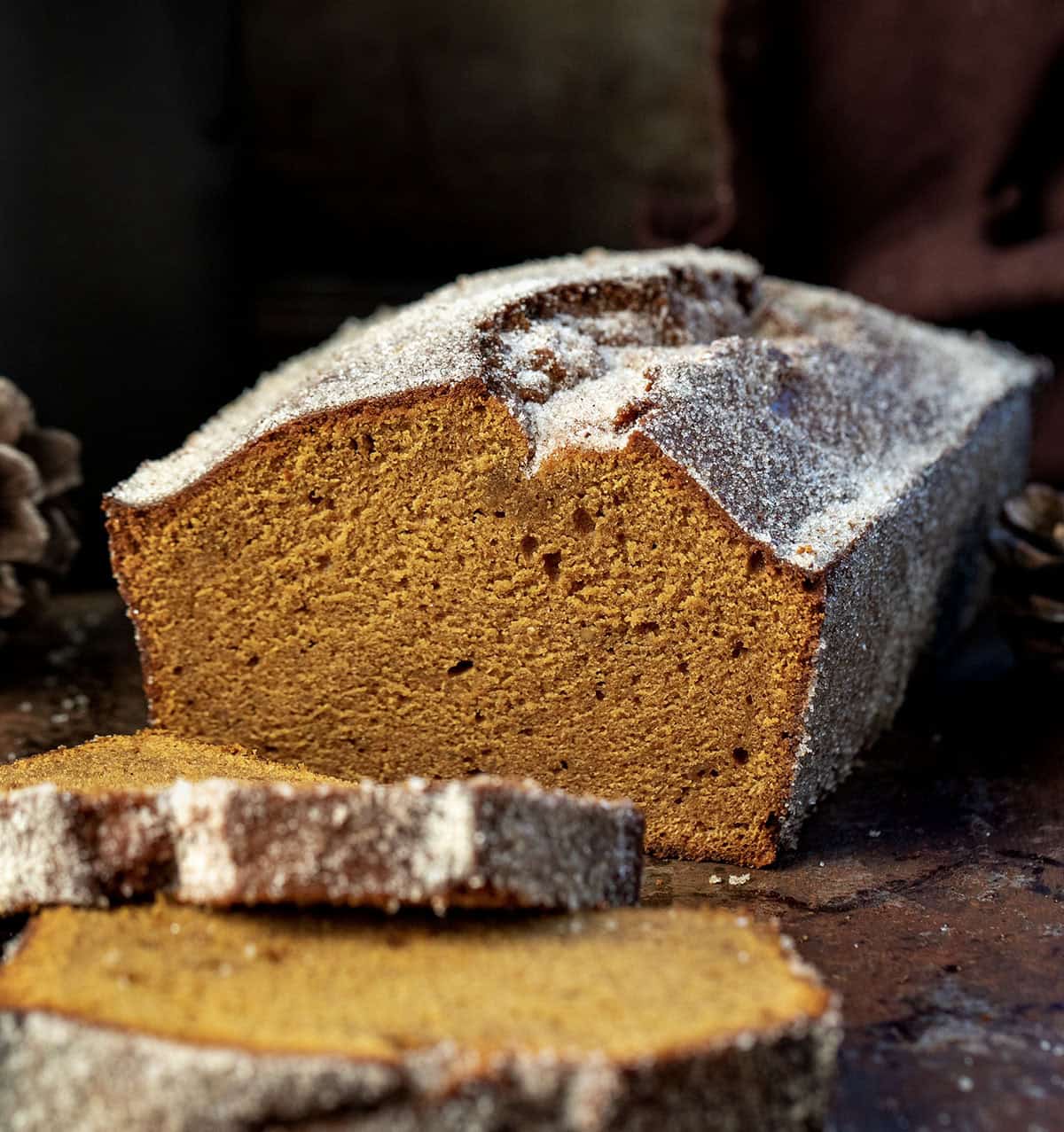 Loaf of Gingerbread Donut Bread that has been cut and has pieces laying flat.
