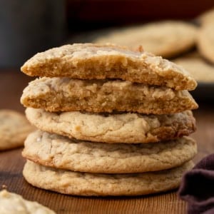 Small stack of Maple Cookies with the top cookie broken in half showing inside texture.