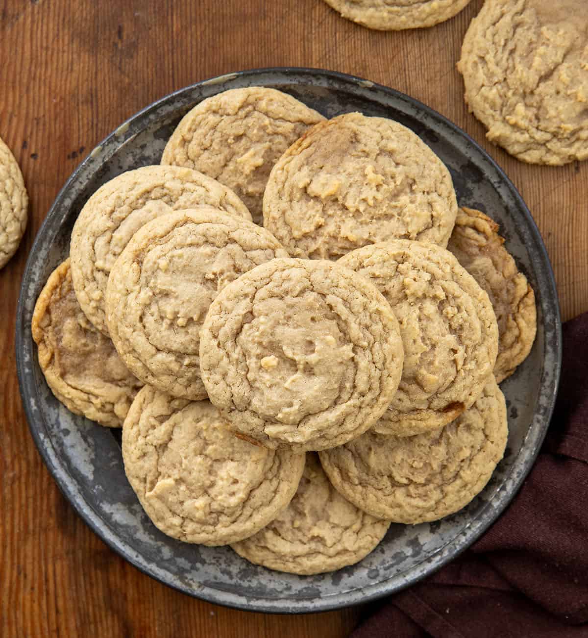 Plate of Maple Cookies on a wooden table from overhead. 