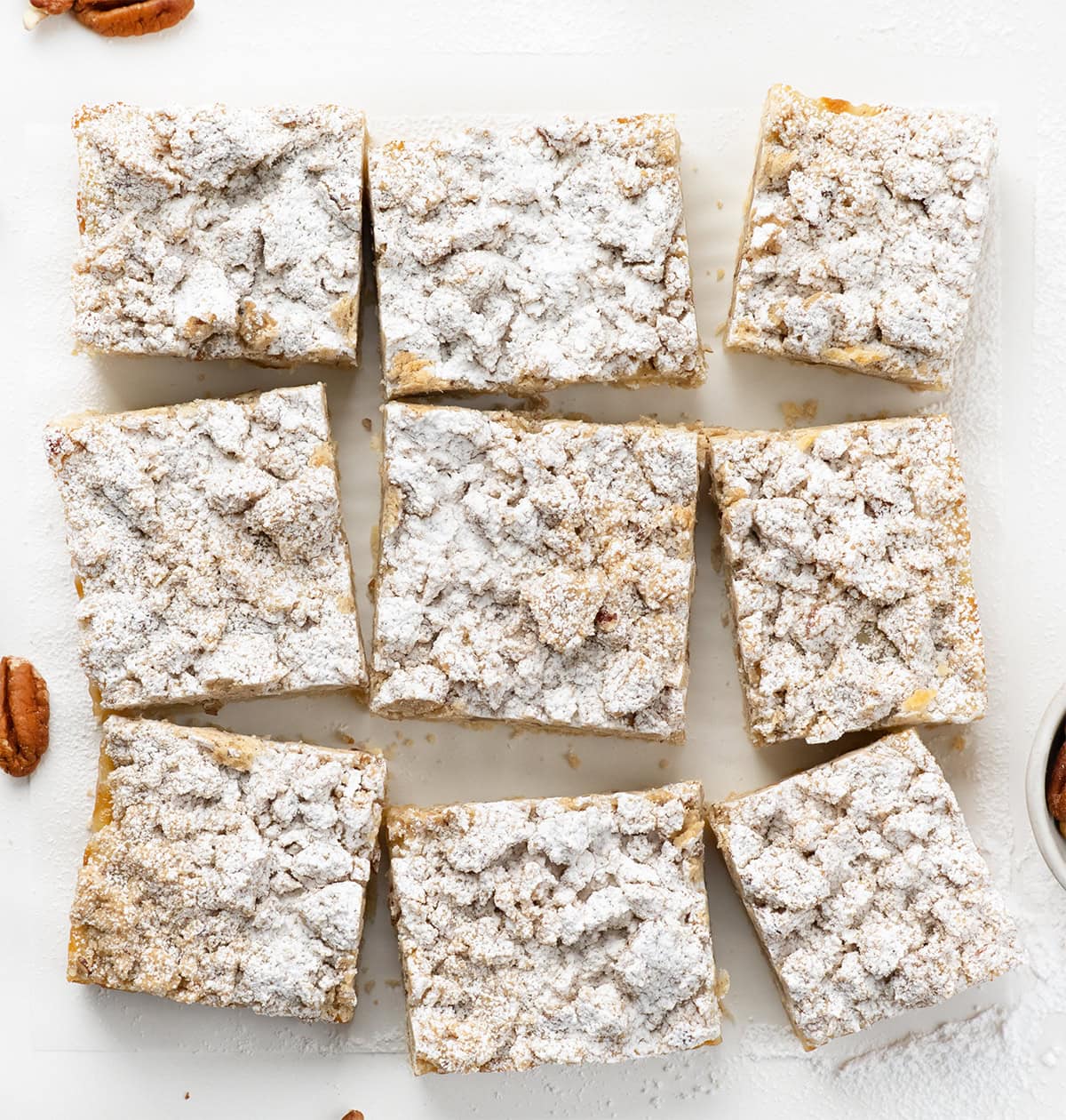 Pecan Vanilla Cream Crumb Bars that have been cut into squares.
