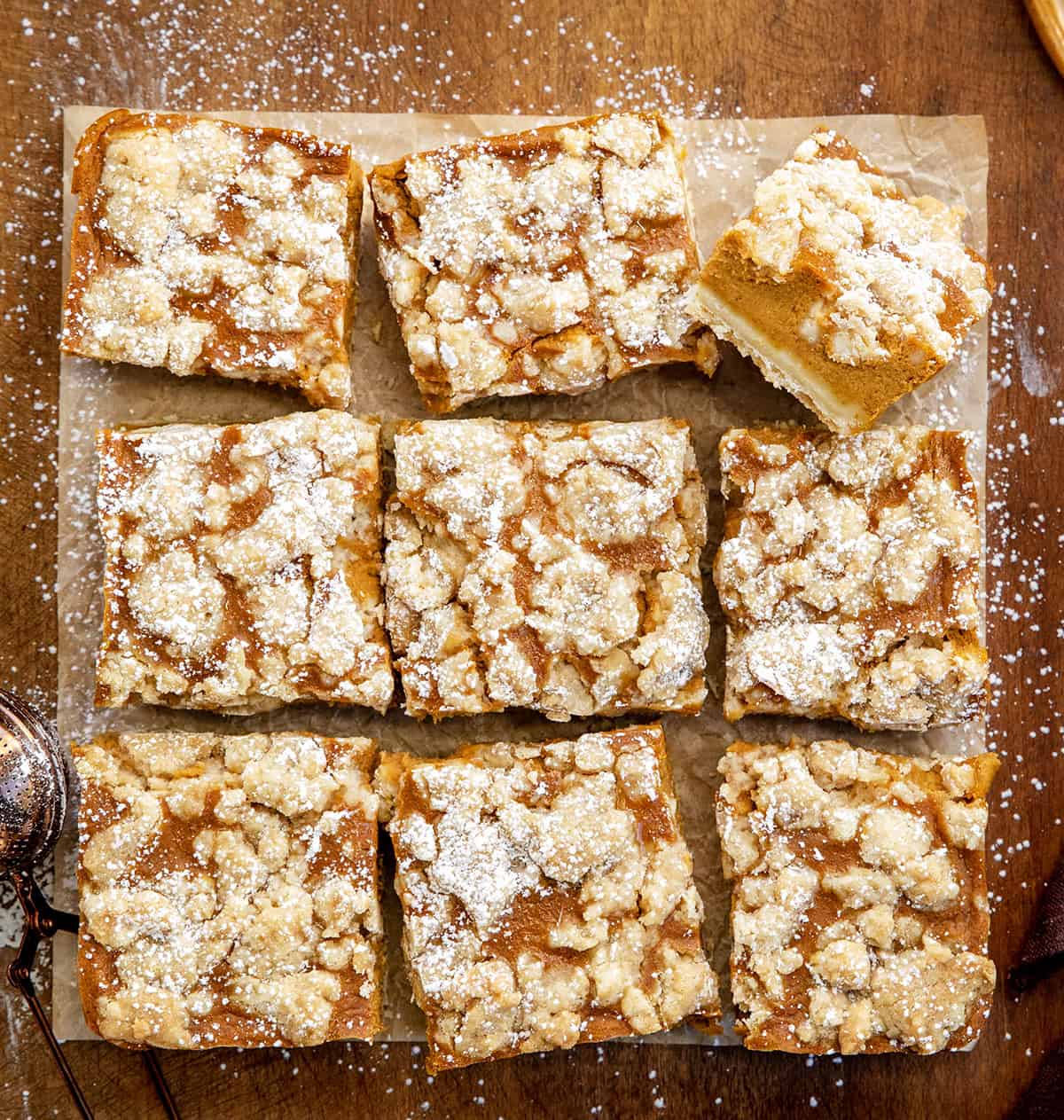 Pumpkin Cream Crumb Bars cut into squares with one bar on its side from overhead.